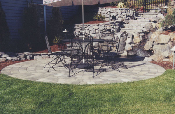 Patio hardscape with large rocks and stairs